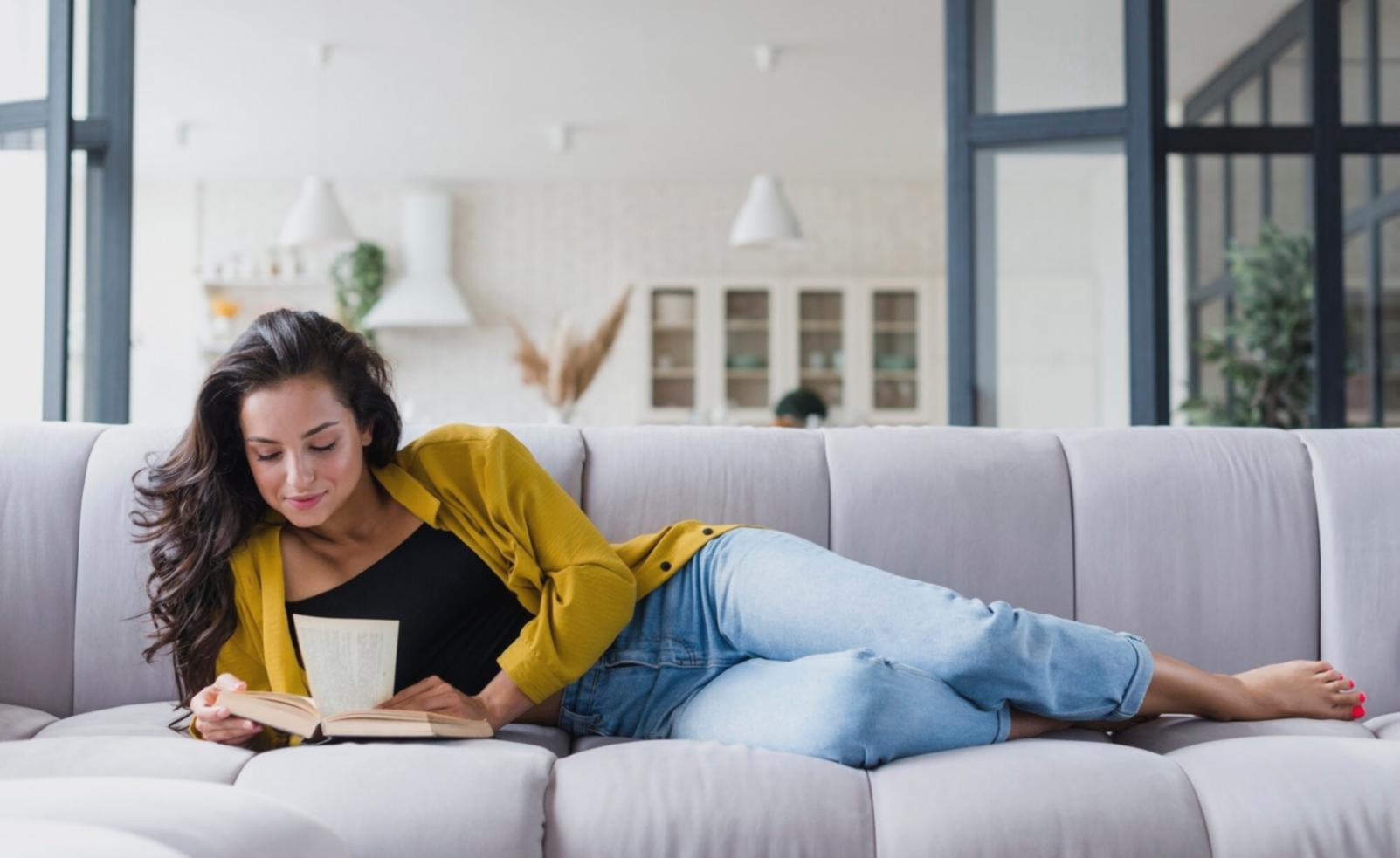 Professional analyzing financial documents with charts and graphs displayed on computer screens